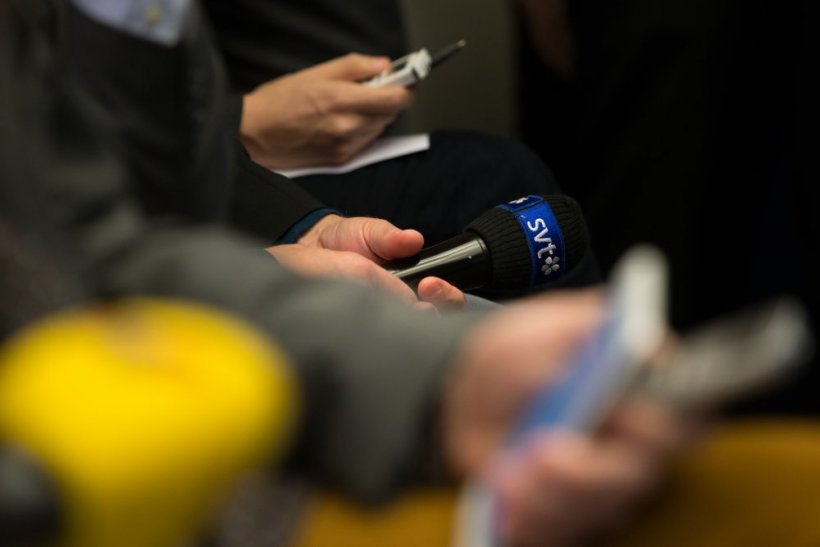A microphone with the Swedish public broadcaster's logo.
